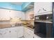 Kitchen featuring white cabinets, modern appliances including a range and built in oven and ample counter space at 2100 World Parkway Blvd # 30, Clearwater, FL 33763