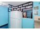 Modern kitchen featuring a large refrigerator, ample counter space, and a pass through to the living area at 2100 World Parkway Blvd # 30, Clearwater, FL 33763