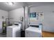 Community laundry room with modern washers and dryers for convenient resident use at 2100 World Parkway Blvd # 30, Clearwater, FL 33763