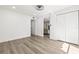 Bedroom featuring light wood floors, a window, and a double door closet at 2101 Cordova Grn, Seminole, FL 33777