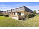 Attractive townhouse with a tiled patio, lush lawn, and mature landscaping at 2101 Cordova Grn, Seminole, FL 33777