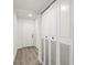 Hallway with wood-look flooring and closet space at 2101 Cordova Grn, Seminole, FL 33777