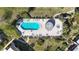Aerial view of a community pool and hot tub with plenty of seating at 2101 Cordova Grn, Seminole, FL 33777