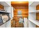 Walk-in closet with custom shelving and storage space perfect for organizing clothes and accessories at 2101 Cordova Grn, Seminole, FL 33777