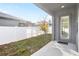 An open backyard space with a covered patio at 219 Villa Luna Ln, Lutz, FL 33549
