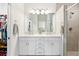 Bathroom features double sinks, modern fixtures, and a glass-enclosed shower at 219 Villa Luna Ln, Lutz, FL 33549