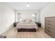 Bright bedroom boasts generous space, complemented by serene decor and furnishings at 219 Villa Luna Ln, Lutz, FL 33549