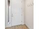 Bright entryway features coat hooks and adjacent sidelight window at 219 Villa Luna Ln, Lutz, FL 33549
