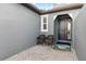 Charming front porch with seating, creating a welcoming entrance at 219 Villa Luna Ln, Lutz, FL 33549