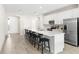 Bright kitchen boasts an expansive island with seating and modern stainless steel appliances at 219 Villa Luna Ln, Lutz, FL 33549