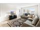 Living room showcases stylish rug and decor, offering a cozy space for relaxation and entertaining at 219 Villa Luna Ln, Lutz, FL 33549