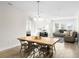 Open-concept living room with dining area and abundant natural light at 219 Villa Luna Ln, Lutz, FL 33549