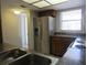 Functional kitchen equipped with stainless steel appliances, ample counter space, and plenty of storage at 233 Woodlake Wynde, Oldsmar, FL 34677