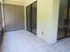 Enclosed screened lanai featuring tile flooring, ample natural light, and privacy at 233 Woodlake Wynde, Oldsmar, FL 34677