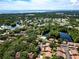 Aerial view of the community showcasing the pool, lakes, and lush landscaping at 2364 Flanders Way # 41-D, Safety Harbor, FL 34695