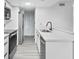 Modern kitchen featuring stainless steel appliances, and sleek white countertops at 2535 E Stanley Matthew Cir, Tampa, FL 33604