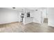 Spacious living room features modern flooring and an open layout to the kitchen at 2535 E Stanley Matthew Cir, Tampa, FL 33604
