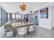 Open-concept dining area with stylish chandelier, large windows, and ocean views at 301 1St S St # 3103, St Petersburg, FL 33701