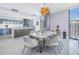 Elegant dining room with a modern chandelier, stylish decor, and a view of the city at 301 1St S St # 3103, St Petersburg, FL 33701