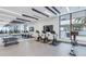 Well-lit gym featuring stationary bikes, free weights, TV, and a mirrored wall at 301 1St S St # 3103, St Petersburg, FL 33701