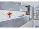 Contemporary kitchen with custom cabinetry, quartz counters, and stunning city views at 301 1St S St # 3103, St Petersburg, FL 33701