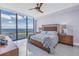 Spacious main bedroom features a large window with ocean view, ceiling fan, and upscale furnishings at 301 1St S St # 3103, St Petersburg, FL 33701