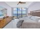 Bright main bedroom with a large window and ocean view, with a queen bed and artwork at 301 1St S St # 3103, St Petersburg, FL 33701