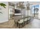 Conference room featuring modern light fixtures, large table, TV and a waterfront view at 301 1St S St # 3103, St Petersburg, FL 33701