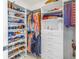 Functional walk-in closet with shelves, hanging rods, drawers, and ample storage for clothes and accessories at 301 1St S St # 3103, St Petersburg, FL 33701