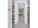 Well-organized walk-in closet featuring built-in shelves and rods, plus decorative wall art at 301 1St S St # 3103, St Petersburg, FL 33701