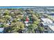 An aerial view showcasing the neighborhood with mature trees and proximity to the bay at 304 David Ave, Clearwater, FL 33759