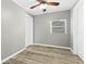 Bright bedroom with wood-look flooring and neutral walls at 304 David Ave, Clearwater, FL 33759