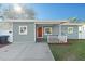 Charming home featuring a front porch and a well-maintained lawn at 304 David Ave, Clearwater, FL 33759