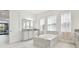Bright, spacious bathroom with a large soaking tub, double vanities, and natural light at 3280 Juniper Springs St, Wesley Chapel, FL 33543