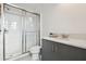 Bathroom featuring a walk-in shower with glass doors and a gray vanity with a white countertop at 3280 Juniper Springs St, Wesley Chapel, FL 33543