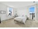 Bright bedroom with white walls, light carpet, and two large windows at 3280 Juniper Springs St, Wesley Chapel, FL 33543