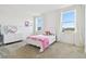 Bedroom featuring a white bed, large windows, white dresser, and neutral carpet at 3280 Juniper Springs St, Wesley Chapel, FL 33543