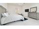 Bright, spacious bedroom with a king bed and modern, elegant furnishings at 3280 Juniper Springs St, Wesley Chapel, FL 33543