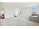 Spacious bonus room featuring plush carpeting and a charming small gray bed at 3280 Juniper Springs St, Wesley Chapel, FL 33543