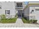 Elegant home entrance with stone accents, beautiful landscaping, and a paved walkway at 3280 Juniper Springs St, Wesley Chapel, FL 33543