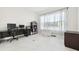 Bright office space featuring sleek tile flooring, a desk setup, and ample storage at 3280 Juniper Springs St, Wesley Chapel, FL 33543