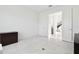 Wide office view revealing bright tile flooring, office space, and an open doorway at 3280 Juniper Springs St, Wesley Chapel, FL 33543