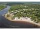 Aerial view of the waterfront park showing beach, picnic areas, and boat launch at 3857 Sailmaker Ln, Holiday, FL 34691