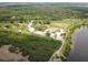Anclote Gulf Park aerial view featuring lush greenery, waterways, and recreational facilities at 3857 Sailmaker Ln, Holiday, FL 34691