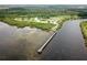 Overhead view of the park's pier, extending into the clear coastal waters at 3857 Sailmaker Ln, Holiday, FL 34691