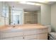 Bathroom featuring single sink vanity, shower stall, and toilet at 3857 Sailmaker Ln, Holiday, FL 34691