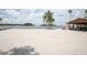 Sandy beach area and a covered picnic area at 3857 Sailmaker Ln, Holiday, FL 34691