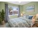 Bright bedroom with a view and decorative coastal themed accents at 3857 Sailmaker Ln, Holiday, FL 34691