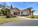 Inviting clubhouse exterior with manicured landscaping and convenient access for residents at 3857 Sailmaker Ln, Holiday, FL 34691