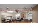 Spacious community room with tables, chairs, and a decorative fireplace for gatherings and events at 3857 Sailmaker Ln, Holiday, FL 34691